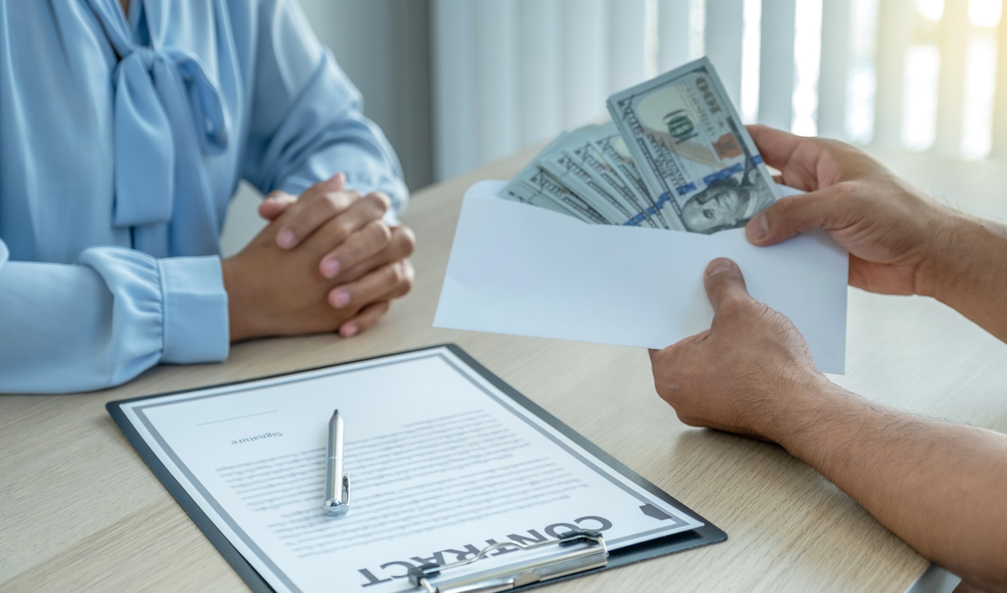 [fpdl.in]_hands-businessmen-who-bribe-government-officials-sign-contracts_177530-28_full